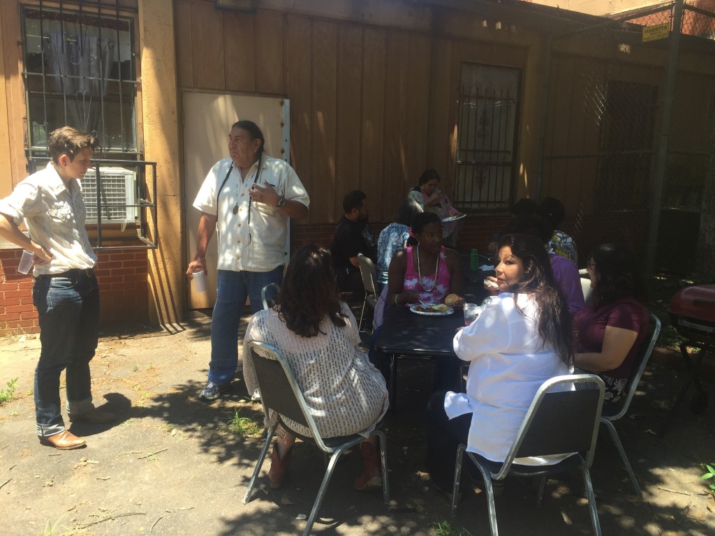 Eating together as a University Sin Fronteras family outside the building of 